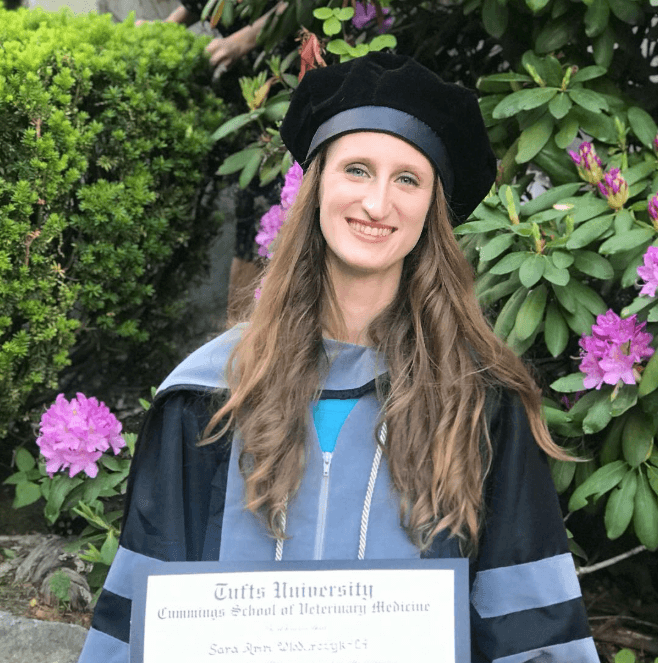 Sara in graduation regalia at Tufts University.